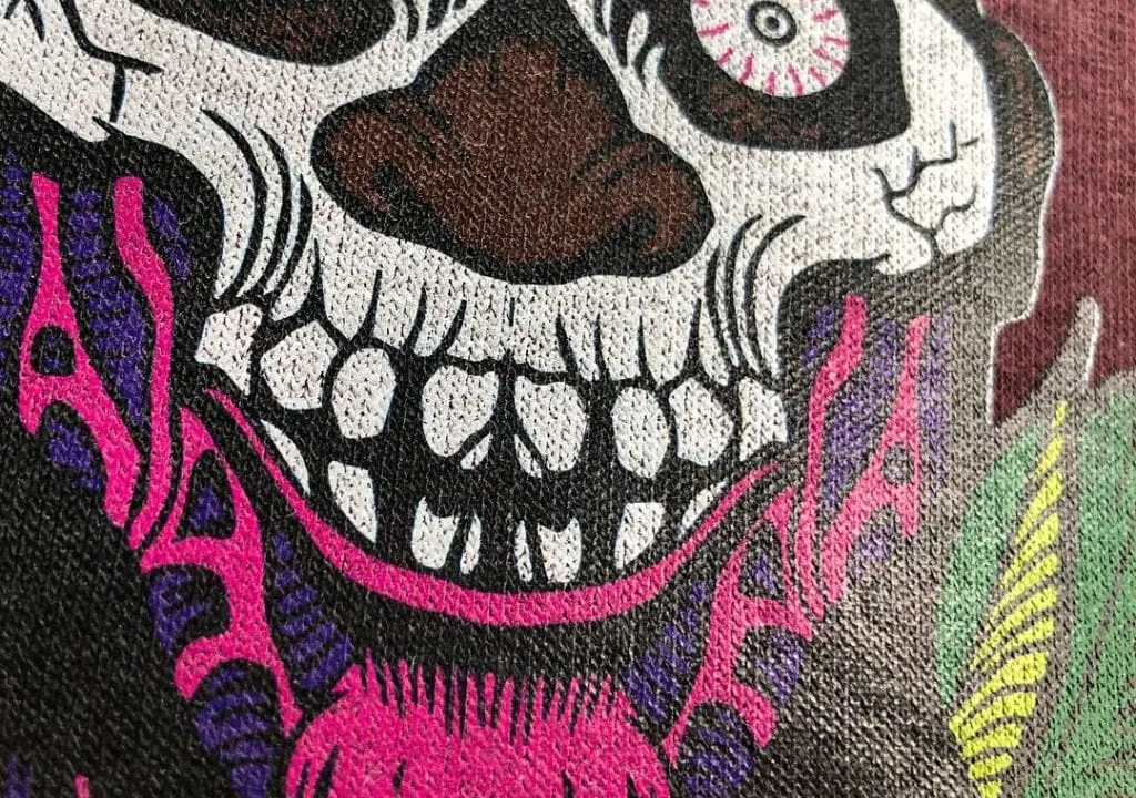 Close-up of a detailed DTG print showing fine lines and bright colours on fabric